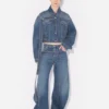 Die blaue Denim-Jeans mit Riemen Die blaue Denim-Jeans mit Riemen