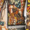 Neuauflage – der gelbe Schmetterlings-Cardigan Neuauflage – der gelbe Schmetterlings-Cardigan